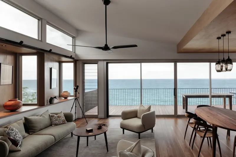 Upper-level living area at Wombarra Clifftops with timber ceilings and ocean views